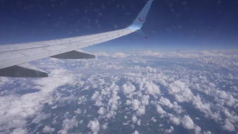 Ground and clouds from airplane window near Paris Stock Footage 275559228
