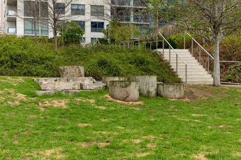 Ground area with circular stone structures and stairs at a green park in an.. 스톡 사진