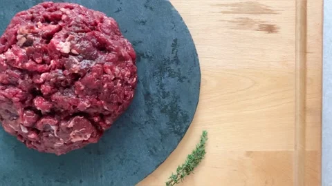 Ground beef for cutlets on a black background Stock Footage 222079696