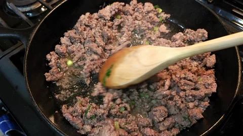 Ground Beef with Green Onion in Cast Iron Skillet Stock Footage 254819701