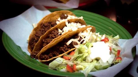Ground beef hard shell Mexican tacos with salad close up Stock Photos