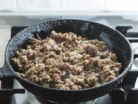 Ground beef roasted on a frying pan Stock Photos