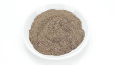 Ground black pepper close up on white background, rotate. 4K UHD video Stock Footage 155003010