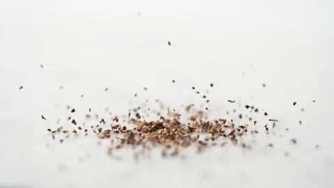 Ground black pepper sprinkled. Slow Motion. Stock Footage 79477783