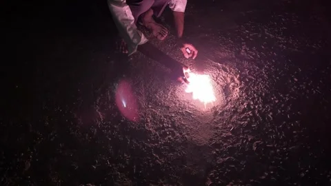 Ground Chakra Firework Spinning at Night | Glowing Fire Spark Celebration 動画素材 319768098