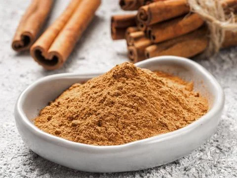 Ground cinnamon on gray background 스톡 사진