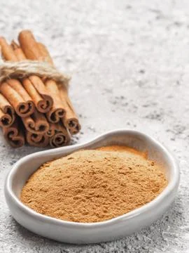 Ground cinnamon on gray background 스톡 사진