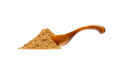 Ground Cinnamon in the wooden spoon, isolated on white backgroun Stock Photos