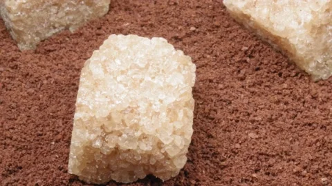 Ground coffee and lumpy cane sugar close-up. Coffee with sugar. Stock Footage 140999699