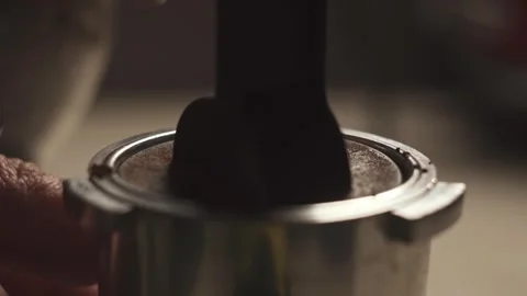 Ground coffee is bottled in the cone of the coffee machine Stock Footage 278208200