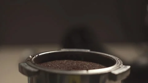 Ground coffee is bottled in the cone of the coffee machine Stock Footage 278208222