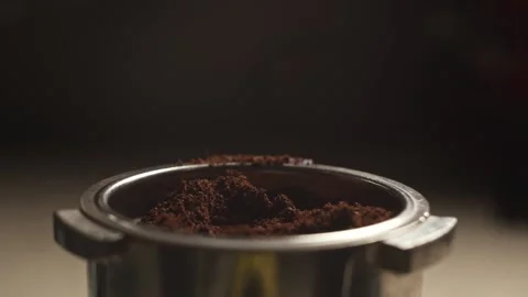 Ground coffee is bottled in the cone of the coffee machine Stock Footage 278208233