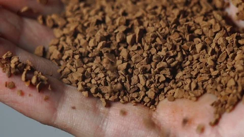 Ground coffee close-up in the men's hand Stock Footage 72251545