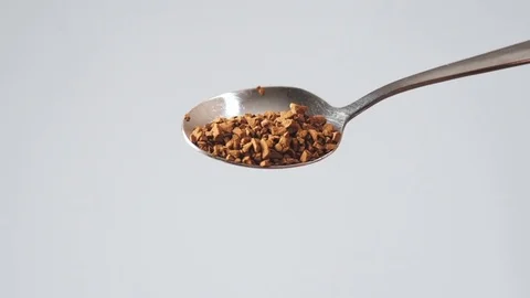 Ground coffee closeup poured from a spoon Stock Footage 72239501