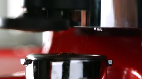 Ground coffee drop from grounder Stockbeeldmateriaal 81792465