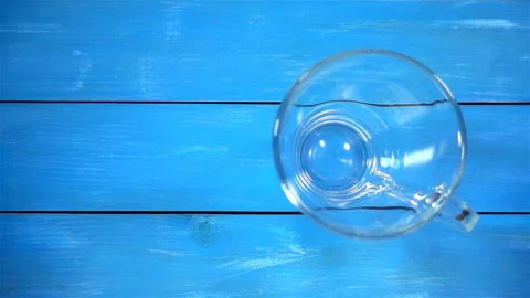 Ground coffee drops in a cup in slow motion Stock Footage 134006113