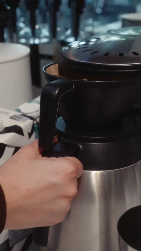 Ground Coffee Filter Inserted into Drip Coffee Maker Stock Footage 339085821
