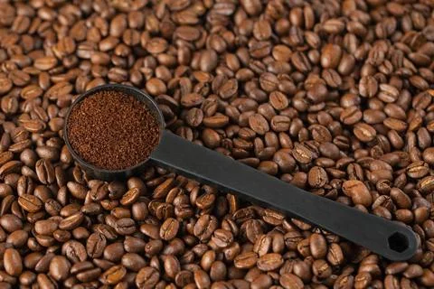 Ground coffee ground coffee on background with coffee beans Copyright: xZo... Stock Photos