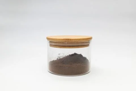Ground coffee in a jar on a white background Stock Photos