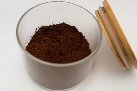 Ground coffee in a jar on a white background Stock Photos