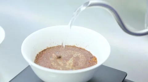 Ground coffee is poured by boiling water Stock Footage 63144064