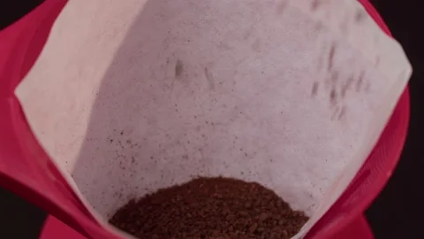 Ground coffee poured into a coffee filter Stock Footage 199473703