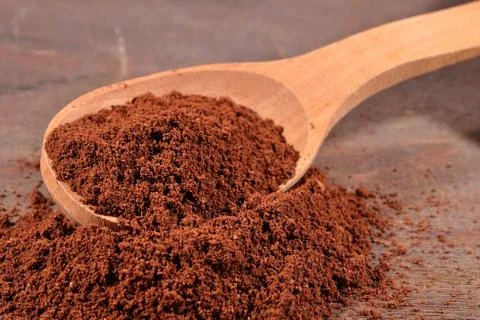 Ground coffee in a spoon Stock Photos