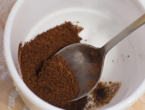 Ground coffee in a white cup Stock Photos