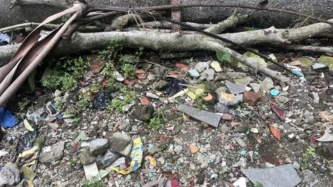 Ground covered with mixed rubble, rocks, and scattered debris including broke Stock Photos