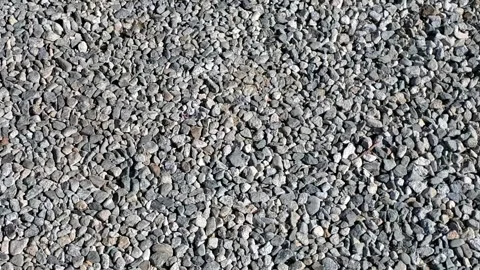 Ground covering of small grey rocks Video stock 152782986