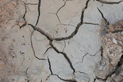 The ground cracks in the top view for the texture background without rain 库存照片