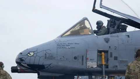Ground crew and pilots prepare an A-10 Thunderbolt II 'Warthog' Stock Footage 111600822