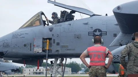 Ground crew and pilots prepare an A-10 Thunderbolt II 'Warthog' Stock Footage 111603071
