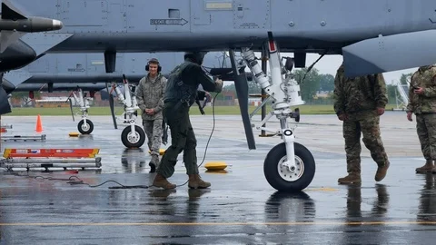 Ground crew and pilots prepare an A-10 Thunderbolt II 'Warthog' Stock Footage 111603890