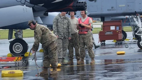 Ground crew and pilots prepare an A-10 Thunderbolt II 'Warthog' Stock Footage 111605377