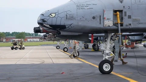 Ground crew and pilots prepare an A-10 Thunderbolt II 'Warthog' Stock Footage 111607640