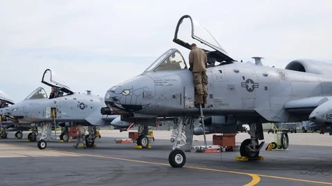Ground crew and pilots prepare an A-10 Thunderbolt II 'Warthog' Stock Footage 111608369