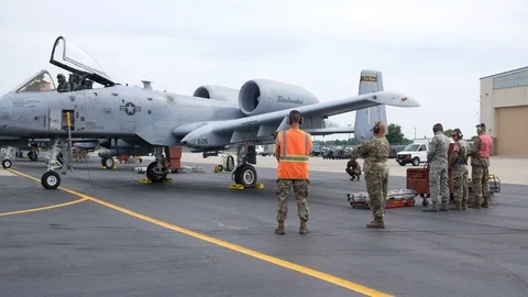 Ground crew and pilots prepare an A-10 Thunderbolt II 'Warthog' Stock Footage 111610922
