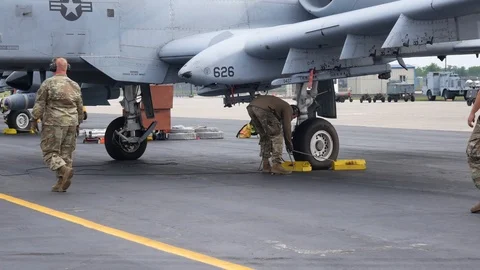 Ground crew and pilots prepare an A-10 Thunderbolt II 'Warthog' Stock Footage 111611553