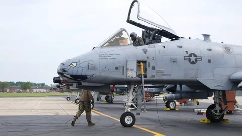 Ground crew and pilots prepare an A-10 Thunderbolt II 'Warthog' Stock Footage 111611817
