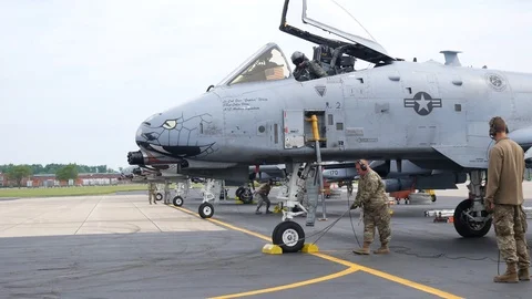 Ground crew and pilots prepare an A-10 Thunderbolt II 'Warthog' Stock Footage 111612069
