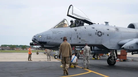 Ground crew and pilots prepare an A-10 Thunderbolt II 'Warthog' Stock Footage 111612685