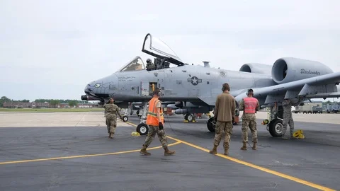 Ground crew and pilots prepare an A-10 Thunderbolt II 'Warthog' Stock Footage 111612905