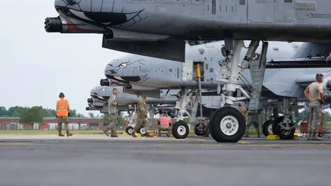 Ground crew and pilots prepare an A-10 Thunderbolt II 'Warthog' Stock Footage 111613128