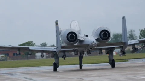 Ground crew and pilots prepare an A-10 Thunderbolt II 'Warthog' Stock Footage 111867298