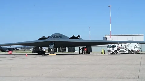 Ground crew conduct hot pit refueling operations with B-2 Spirit stealth bomber Stock Footage 283982021
