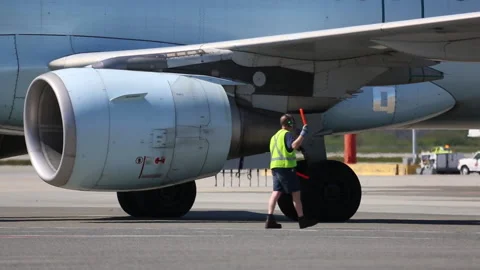 Ground Crew Directing Air Canada Airplane Backwards During Pushback Stock Footage 219227863
