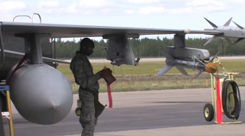 Ground crew doing checks at Red Flag Alaska Stock Footage 32574588