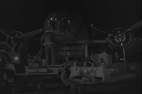 Ground crew load bomb in fighter aircraft - 1944 Stock Footage 108319358