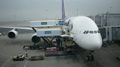 Ground crew loading cargo luggage container plane Stock Footage 18092517